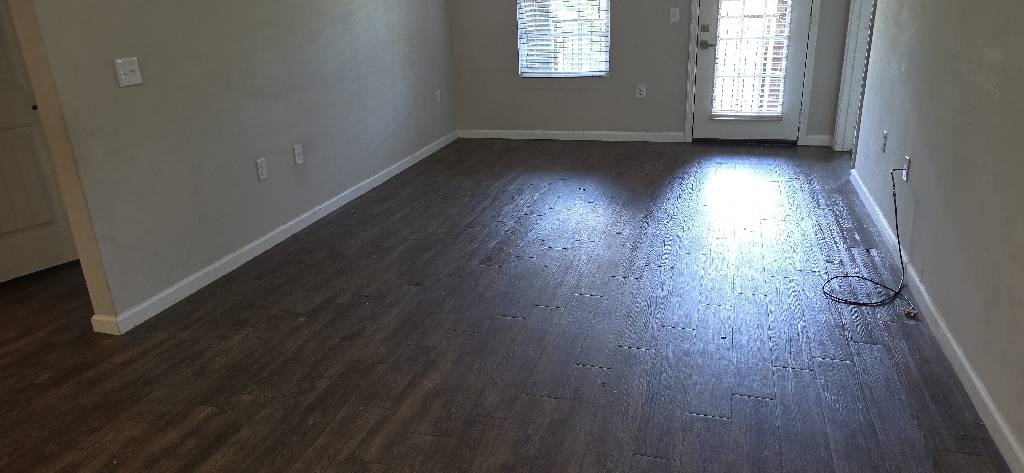 The same Charlotte living area after the furniture was removed