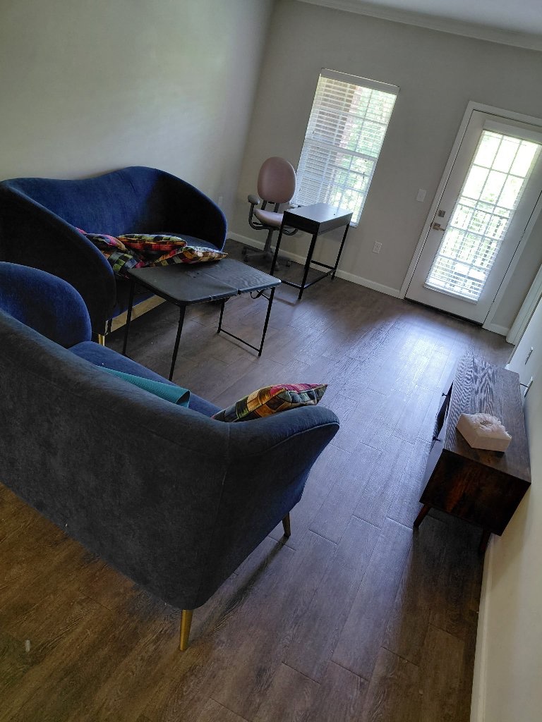 Seating, tables and other furniture in a Charlotte living area before pickup