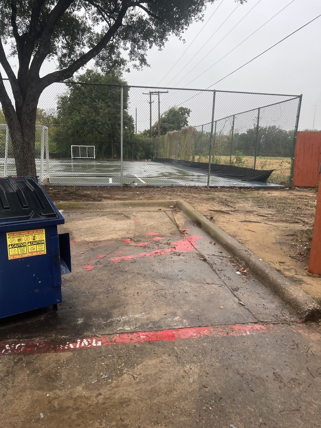 Same dumpster area after bulky debris removal